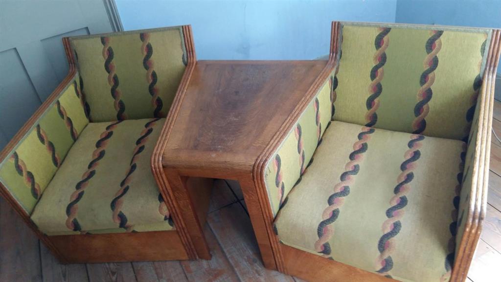 An Art Deco oak three section conversation seat, possibly with its original upholstery, width 170cm, depth 70cm, height 71cm